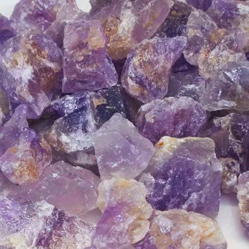 A collection of raw amethyst chunks showcasing their unique purple hues and natural formations.