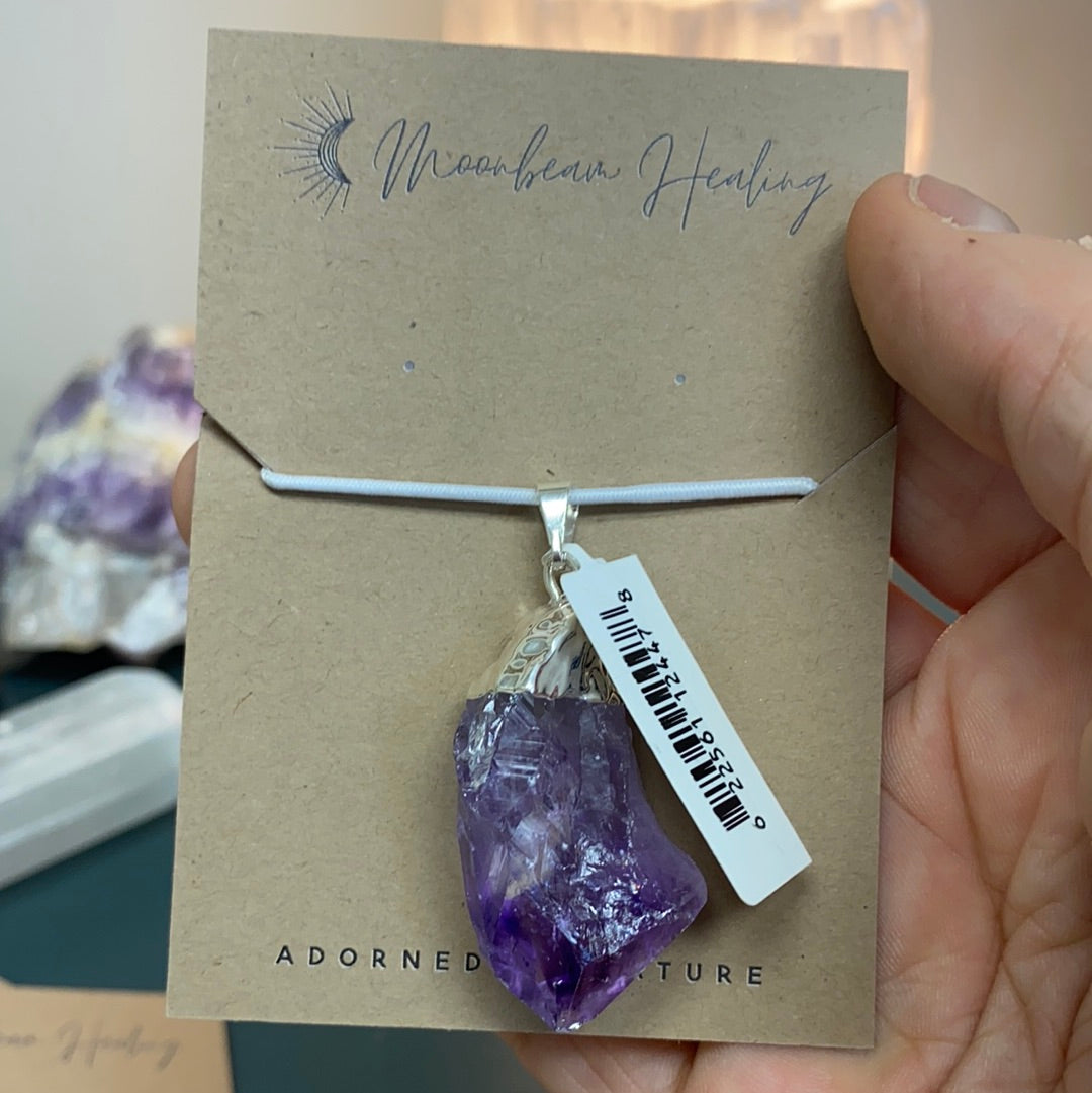 Amethyst Rough Cut Pendant featuring natural Brazilian amethyst points with a silver coating, elegantly designed for beauty and healing.