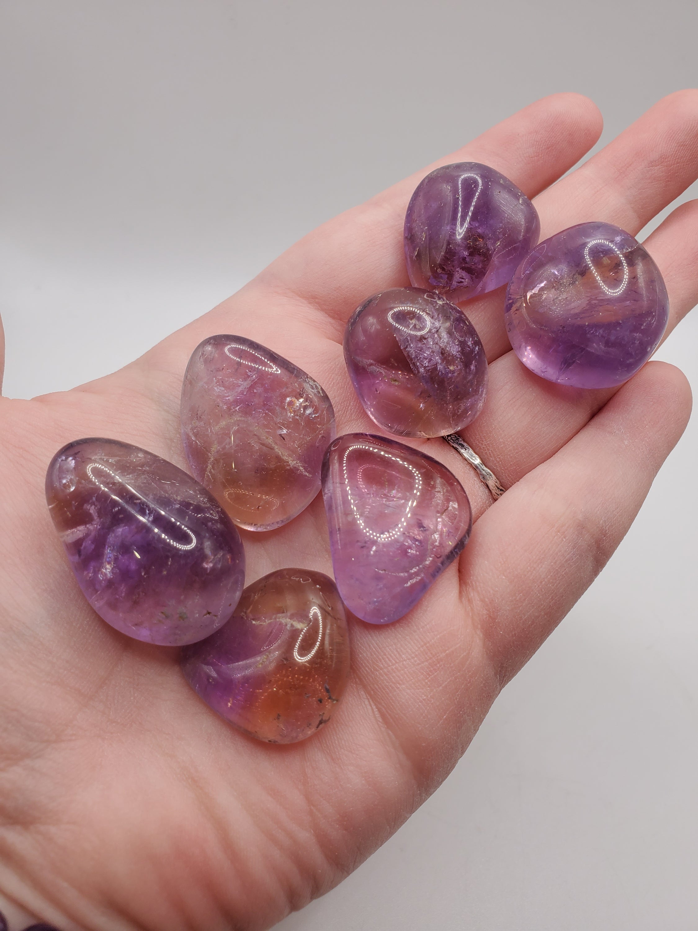 Ametrine Tumbled Stone showcasing its beautiful blend of purple Amethyst and yellow Citrine colors, polished and smooth.