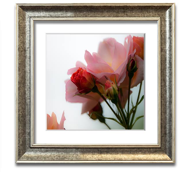 A square framed print featuring an array of vibrant pink flowers, elegantly displayed in a stylish frame.