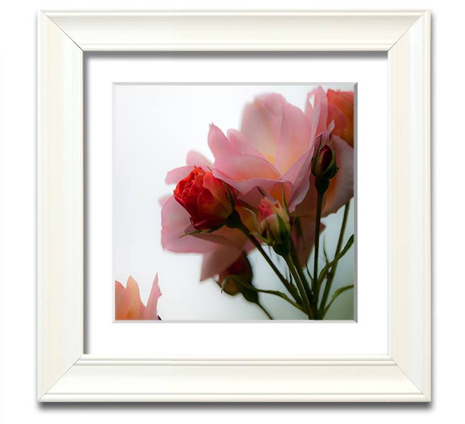 A square framed print featuring an array of vibrant pink flowers, elegantly displayed in a stylish frame.