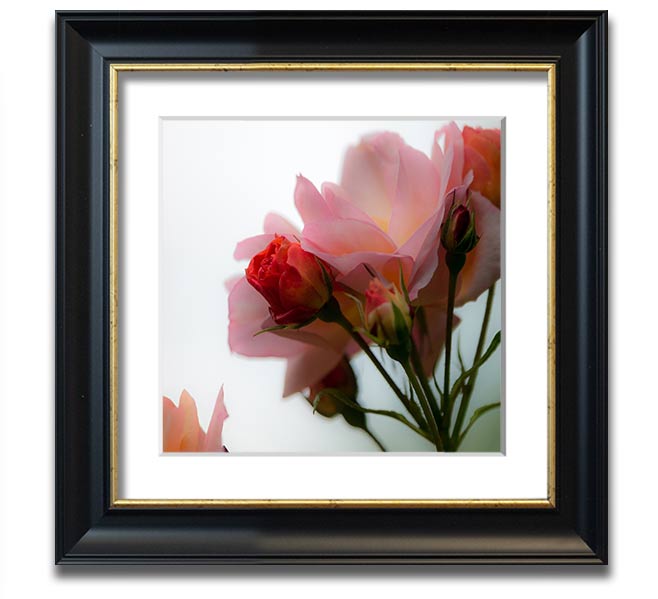 A square framed print featuring an array of vibrant pink flowers, elegantly displayed in a stylish frame.