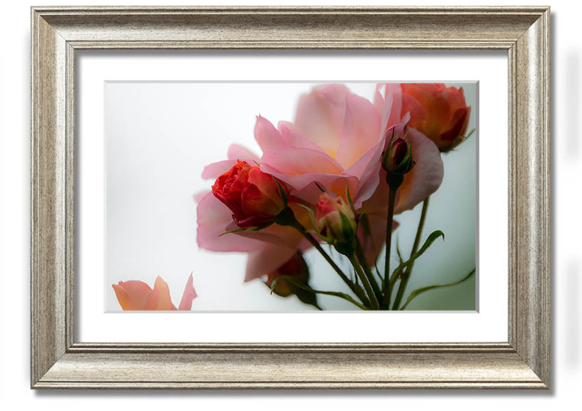 A beautifully framed print of an array of pink flowers, showcasing vibrant colors and intricate details, ready to hang on the wall.