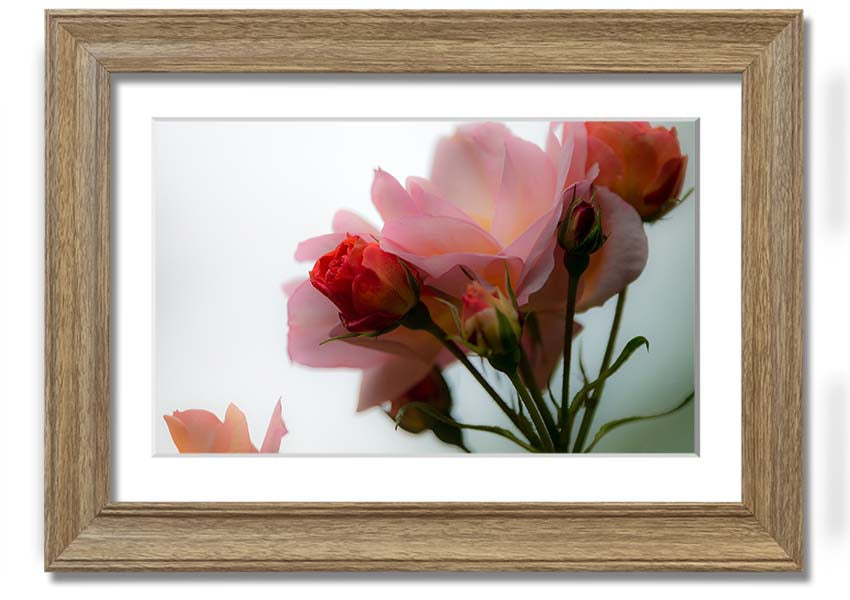 A beautifully framed print of an array of pink flowers, showcasing vibrant colors and intricate details, ready to hang on the wall.