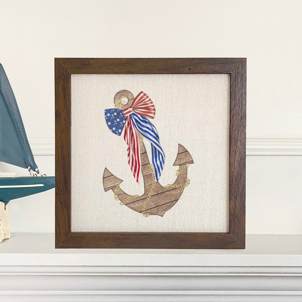 Anchor with Flag Bow framed sign featuring a wood frame and eco-friendly printing on a linen-look background.