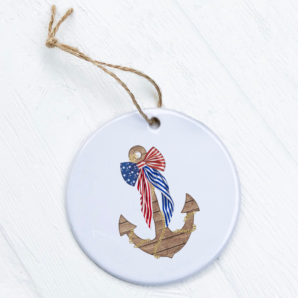 A beautifully crafted porcelain ornament featuring an anchor with a flag bow design, showcasing vibrant colors and a glossy finish.