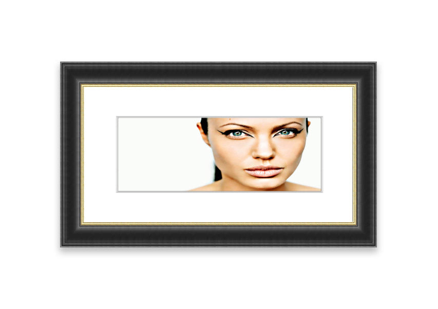 Framed print of Angelina Jolie with cat-like eyes, showcasing her iconic features in a stylish frame.