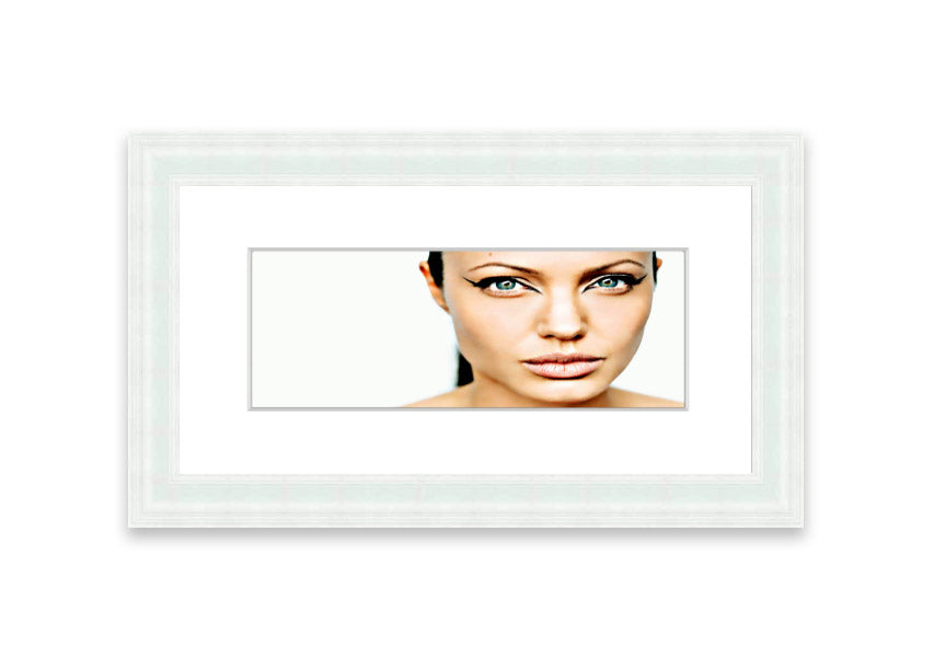 Framed print of Angelina Jolie with cat-like eyes, showcasing her iconic features in a stylish frame.