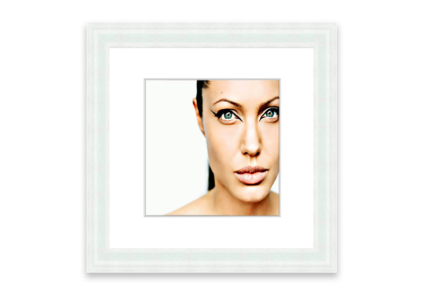 Framed print of Angelina Jolie with cat-like eyes, showcasing her iconic features in a stylish frame.