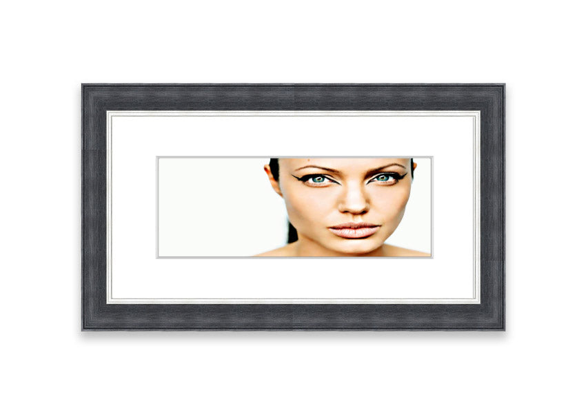 Framed print of Angelina Jolie with cat-like eyes, showcasing her iconic features in a stylish frame.