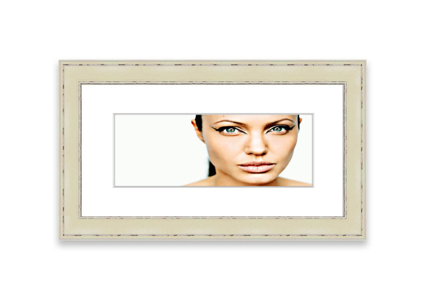 Framed print of Angelina Jolie with cat-like eyes, showcasing her iconic features in a stylish frame.