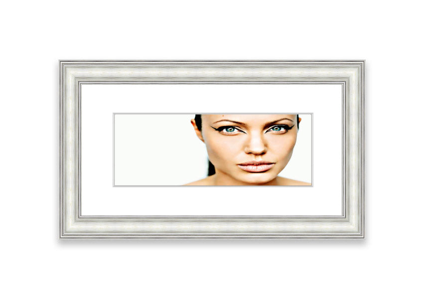 Framed print of Angelina Jolie with cat-like eyes, showcasing her iconic features in a stylish frame.