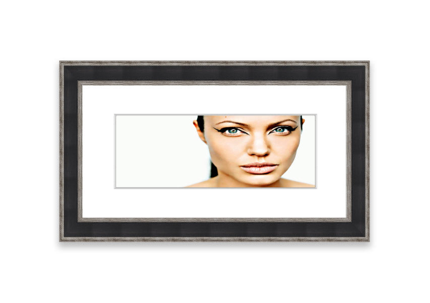 Framed print of Angelina Jolie with cat-like eyes, showcasing her iconic features in a stylish frame.