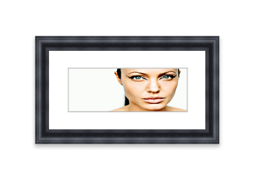 Framed print of Angelina Jolie with cat-like eyes, showcasing her iconic features in a stylish frame.