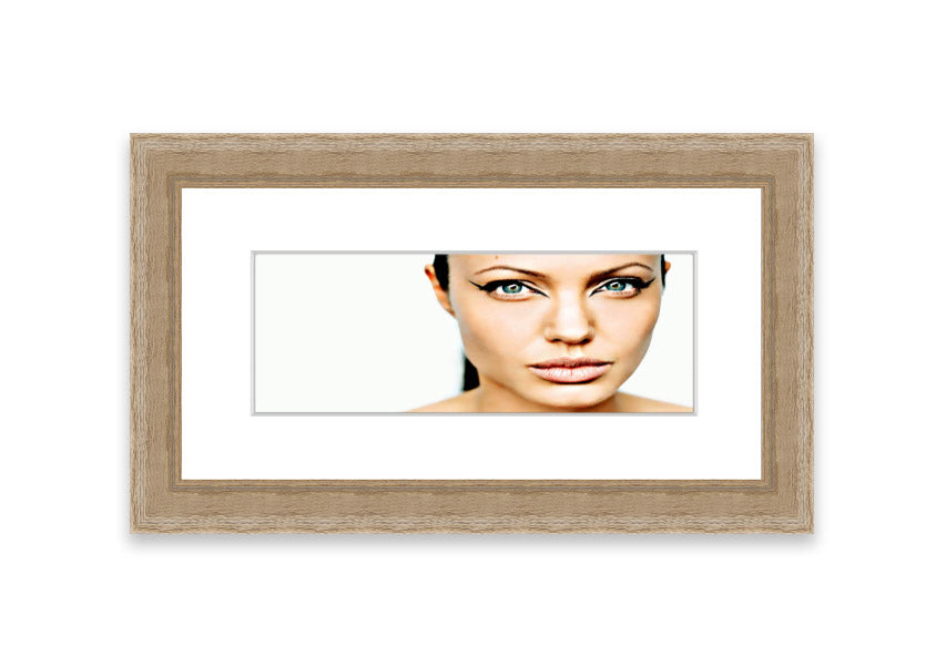 Framed print of Angelina Jolie with cat-like eyes, showcasing her iconic features in a stylish frame.