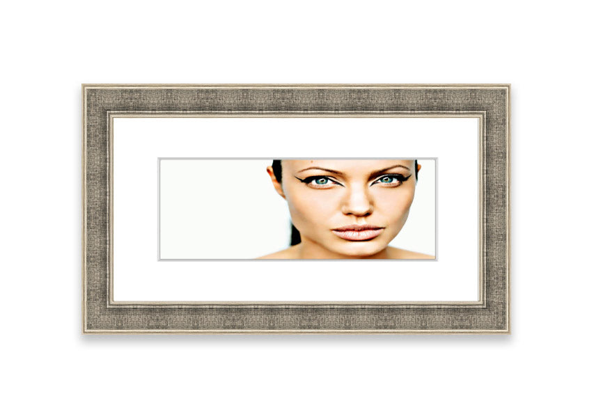 Framed print of Angelina Jolie with cat-like eyes, showcasing her iconic features in a stylish frame.