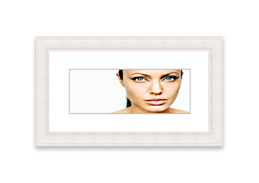 Framed print of Angelina Jolie with cat-like eyes, showcasing her iconic features in a stylish frame.