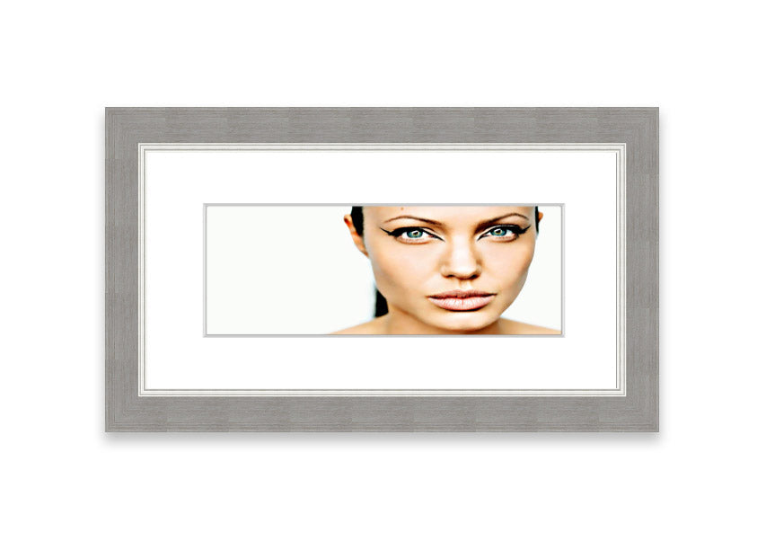 Framed print of Angelina Jolie with cat-like eyes, showcasing her iconic features in a stylish frame.