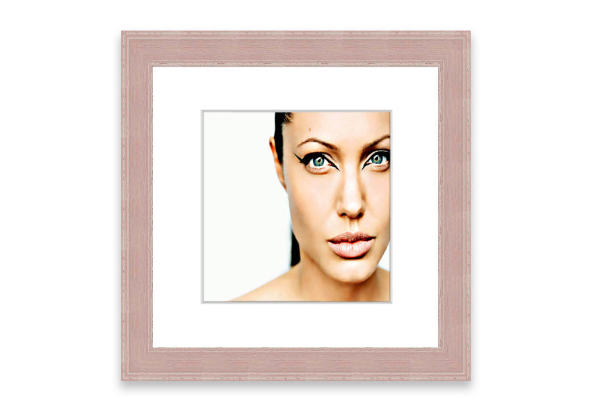 Framed print of Angelina Jolie with cat-like eyes, showcasing her iconic features in a stylish frame.