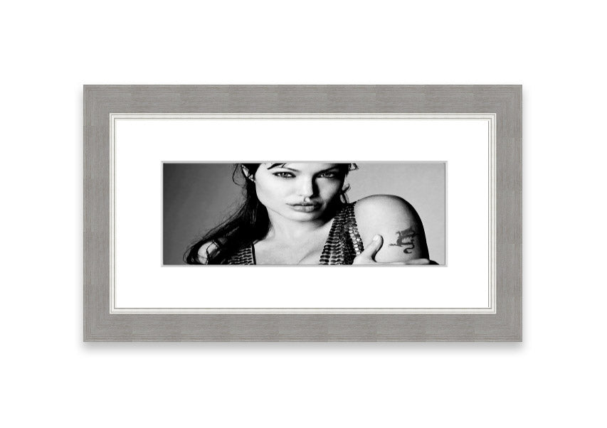 Framed print of Angelina Jolie's dragon tattoo, showcasing intricate details and vibrant colors, available in various frame colors.