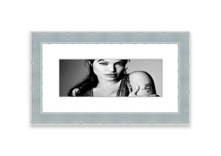 Framed print of Angelina Jolie's dragon tattoo, showcasing intricate details and vibrant colors, available in various frame colors.