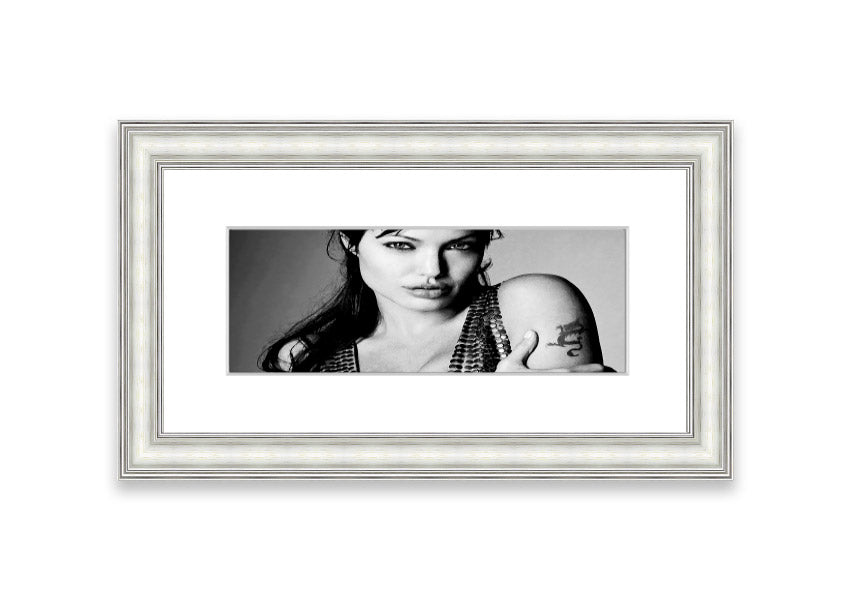 Framed print of Angelina Jolie's dragon tattoo, showcasing intricate details and vibrant colors, available in various frame colors.