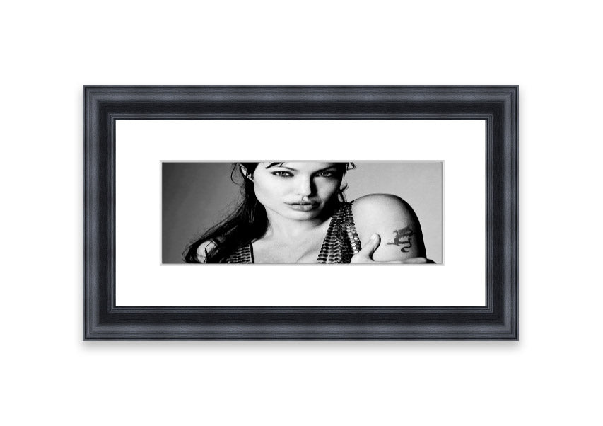 Framed print of Angelina Jolie's dragon tattoo, showcasing intricate details and vibrant colors, available in various frame colors.