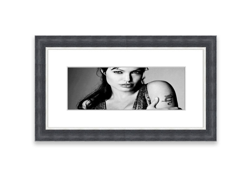 Framed print of Angelina Jolie's dragon tattoo, showcasing intricate details and vibrant colors, available in various frame colors.