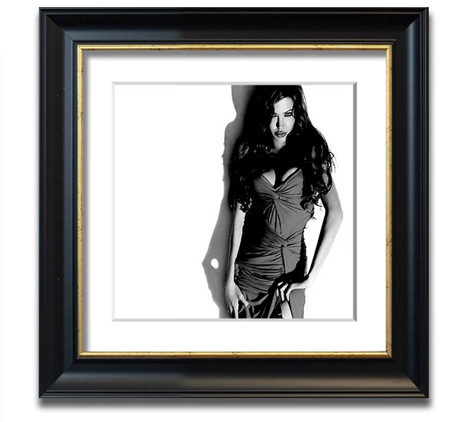 Framed print of Angelina Jolie in a stylish black and white dress, showcasing elegance and sophistication.