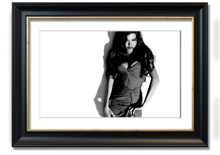 Framed print of Angelina Jolie in a black and white dress, showcasing elegance and style, available in multiple frame colors.