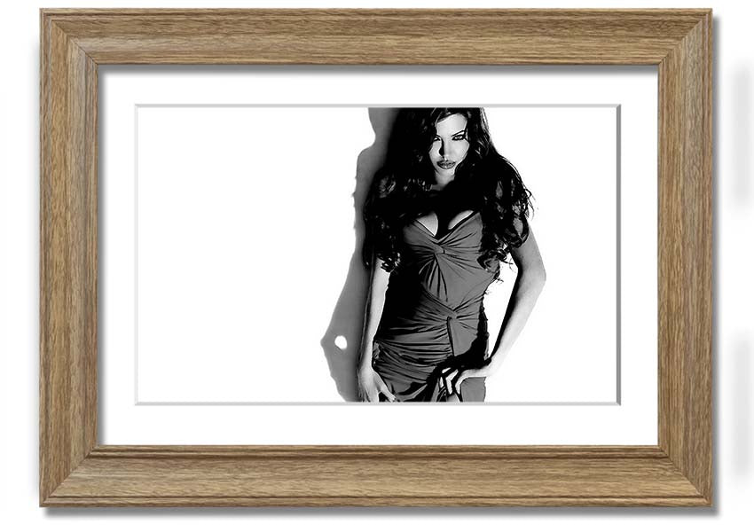 Framed print of Angelina Jolie in a black and white dress, showcasing elegance and style, available in multiple frame colors.