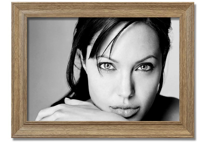 Framed print of Angelina Jolie, showcasing her intimate portrait with elegant framing options.