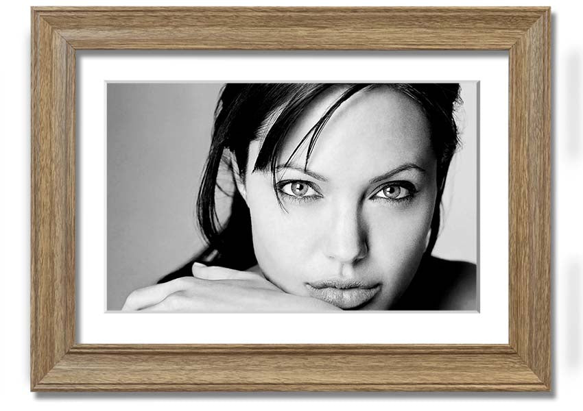 Framed print of Angelina Jolie, showcasing her intimate portrait with elegant framing options.