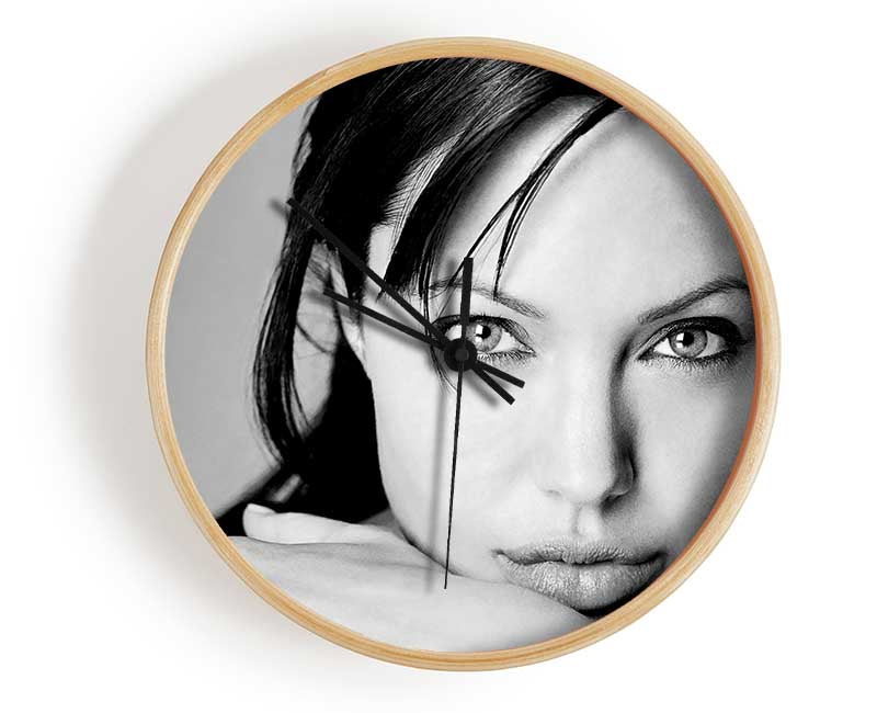 A stylish round clock made from natural bamboo with a clear Plexiglas lens, available in black, white, and natural frame colors.