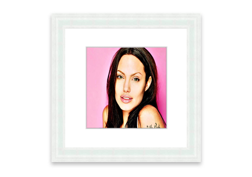 Framed print of Angelina Jolie in pink, showcasing vibrant colors and elegant design, ready to hang.