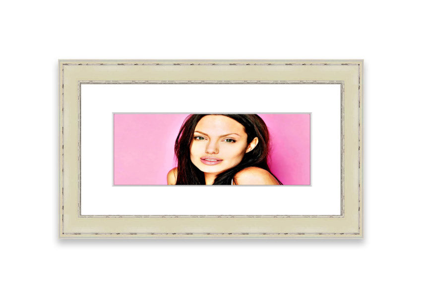 Framed print of Angelina Jolie in pink, showcasing vibrant colors and elegant design, ready to hang.