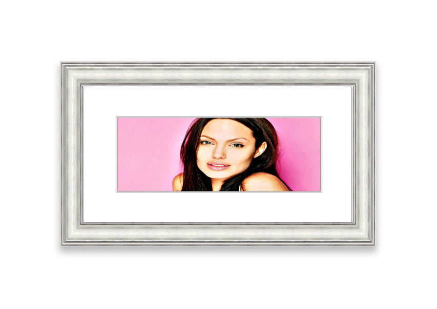 Framed print of Angelina Jolie in pink, showcasing vibrant colors and elegant design, ready to hang.