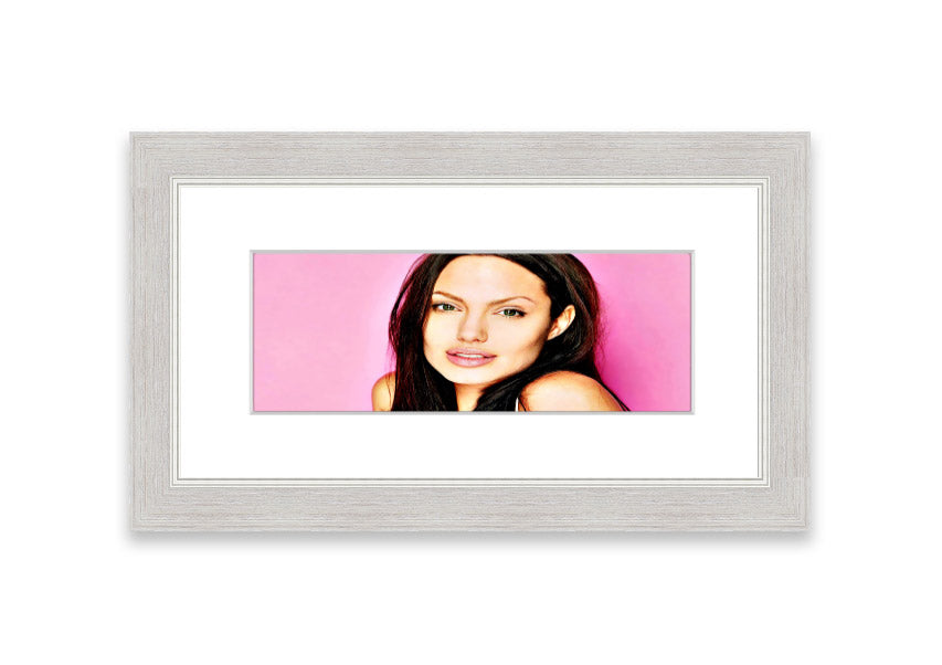 Framed print of Angelina Jolie in pink, showcasing vibrant colors and elegant design, ready to hang.