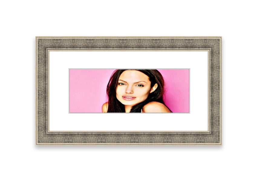 Framed print of Angelina Jolie in pink, showcasing vibrant colors and elegant design, ready to hang.