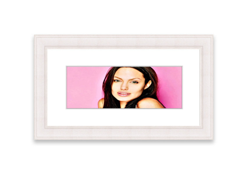 Framed print of Angelina Jolie in pink, showcasing vibrant colors and elegant design, ready to hang.