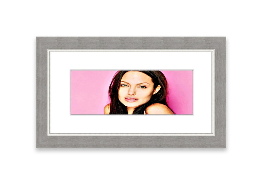 Framed print of Angelina Jolie in pink, showcasing vibrant colors and elegant design, ready to hang.