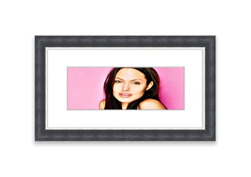 Framed print of Angelina Jolie in pink, showcasing vibrant colors and elegant design, ready to hang.