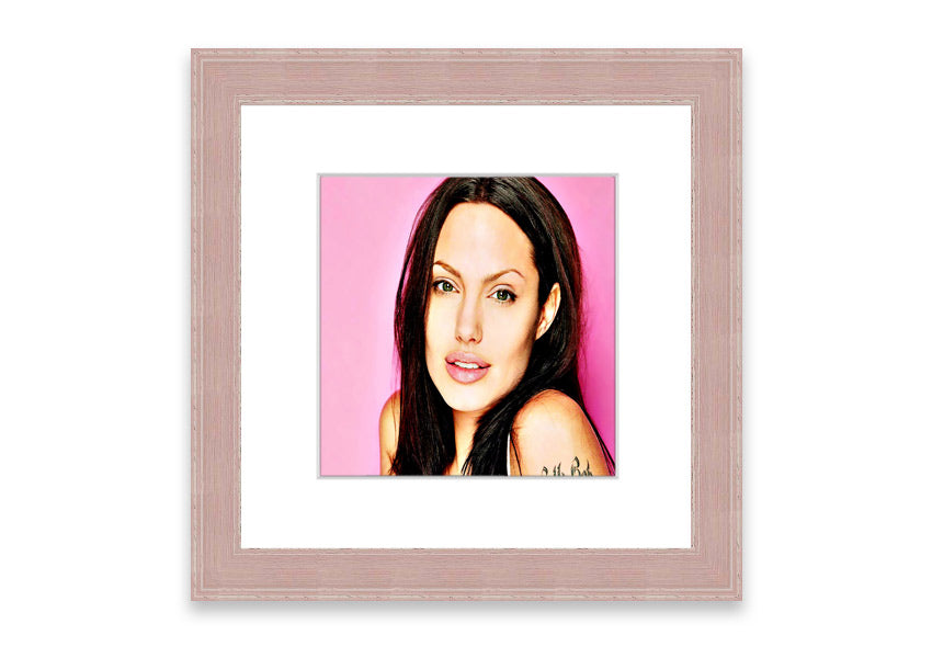 Framed print of Angelina Jolie in pink, showcasing vibrant colors and elegant design, ready to hang.