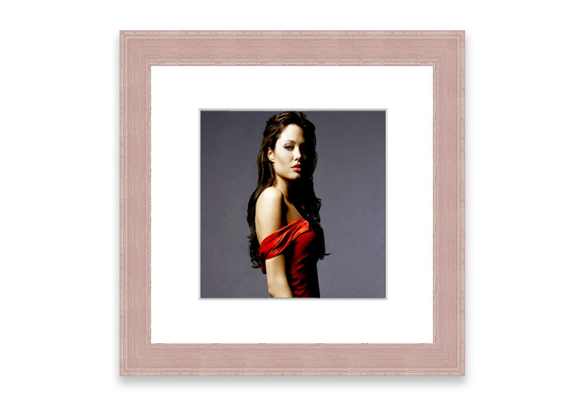 Framed print of Angelina Jolie in a red dress, showcasing elegance and beauty.