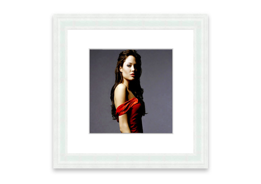 Framed print of Angelina Jolie in a red dress, showcasing elegance and beauty.