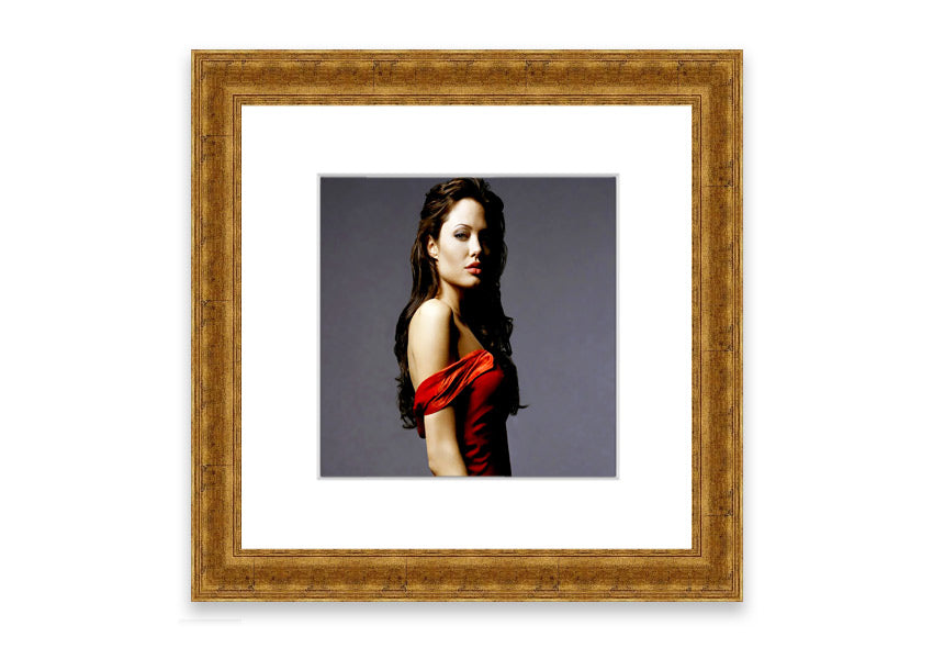 Framed print of Angelina Jolie in a red dress, showcasing elegance and beauty.