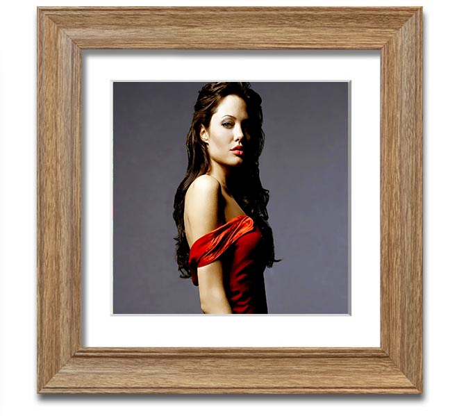 Framed print of Angelina Jolie in a red dress, showcasing elegance and style.