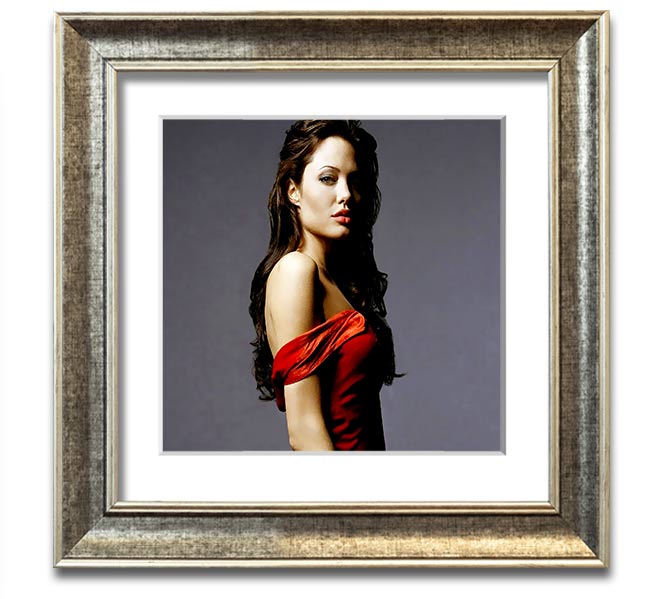 Framed print of Angelina Jolie in a red dress, showcasing elegance and style.