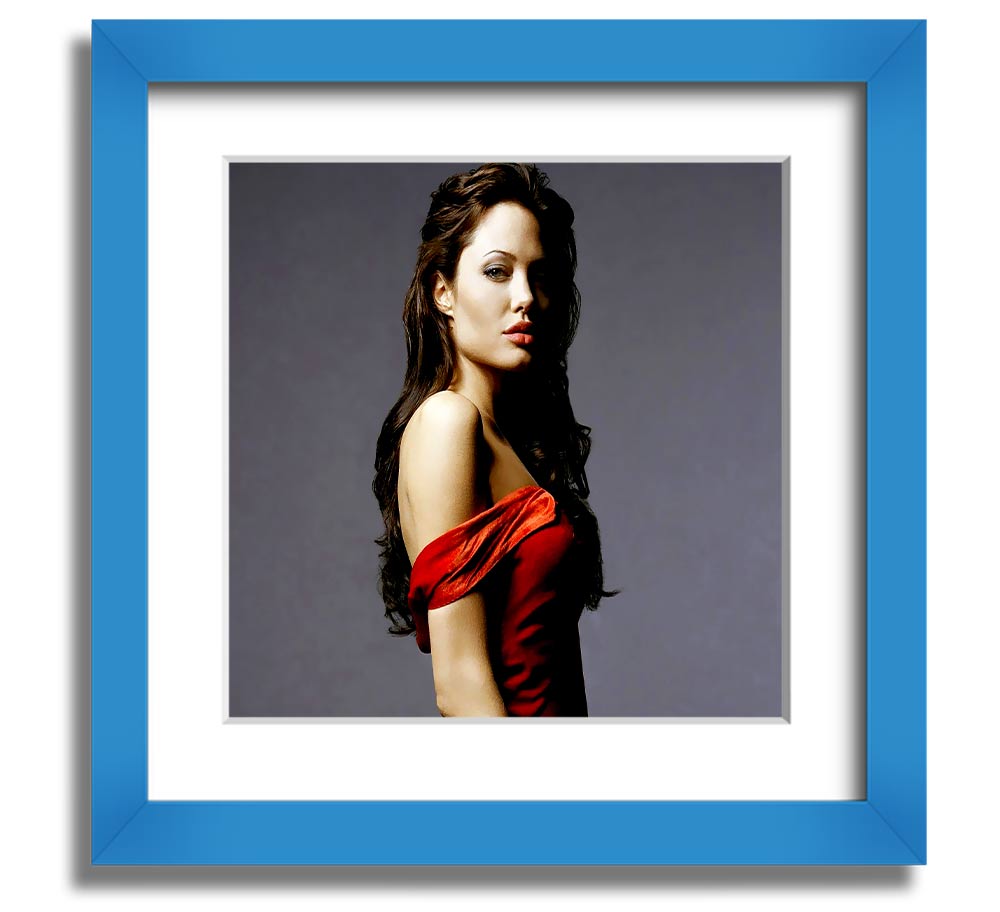 Framed print of Angelina Jolie in a red dress, showcasing elegance and style.