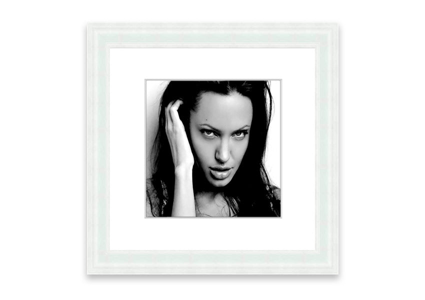 Framed print of Angelina Jolie with captivating eyes, available in various frame colors, handmade in the UK.